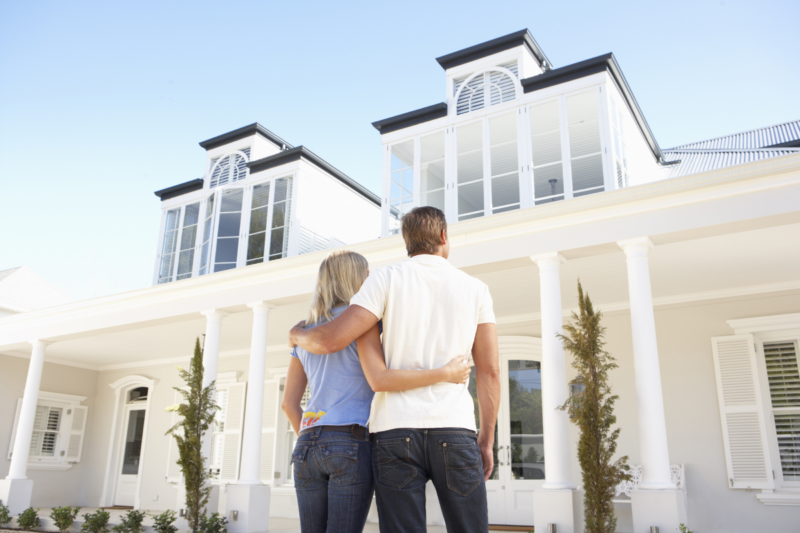 a happy couple finding their dream home